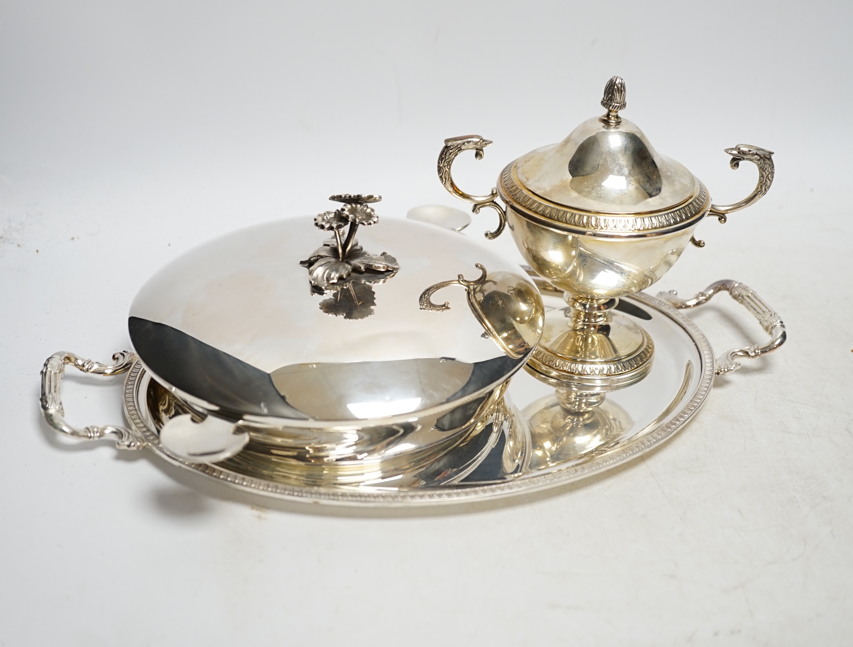 A modern Italian 800 standard two handled small oval tray, 33.6cm, a similar two handled cup and cover and a 925 shallow dish with matched 800 white metal cover, 33.7oz. Condition - fair to good